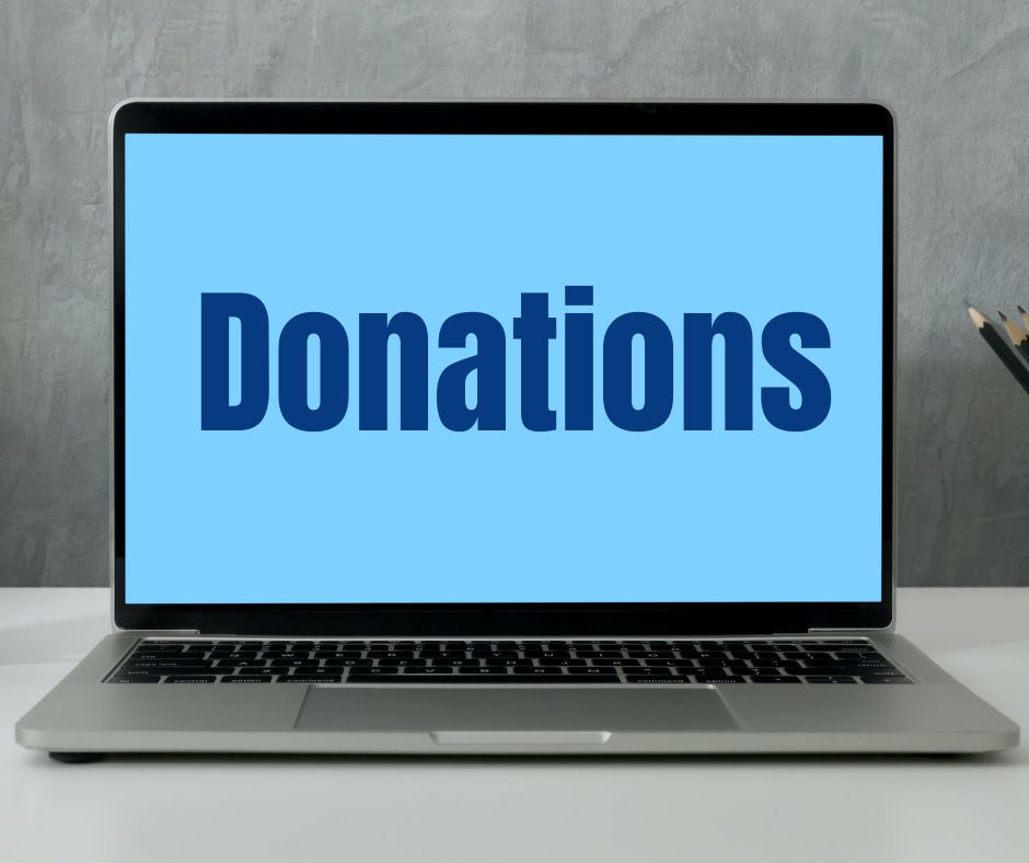 Laptop screen with blue baground and word Donations written on it