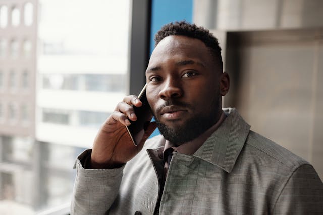Man speaking on the phone to seek support during a difficult time